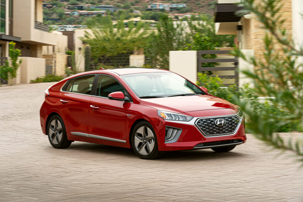 2020 Hyundai Ioniq Hybrid driving in red. (Side-view 3/4 view)


BEST Road-Trip Cars of 2020